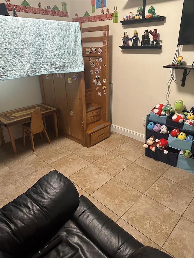 bedroom with light tile patterned floors