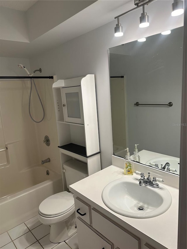 full bathroom with shower / bath combination, tile patterned floors, vanity, and toilet