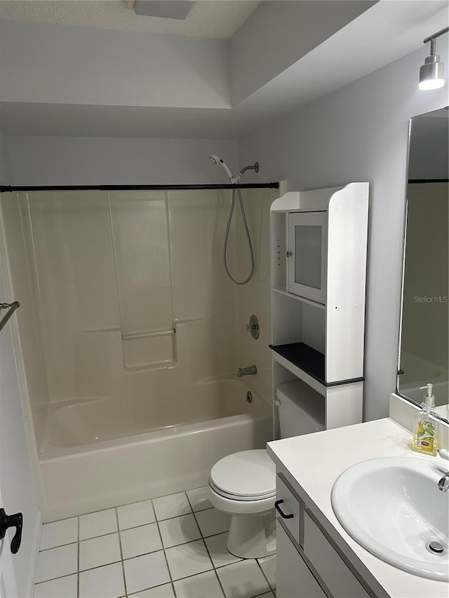 full bathroom with tile patterned flooring, tub / shower combination, vanity, and toilet