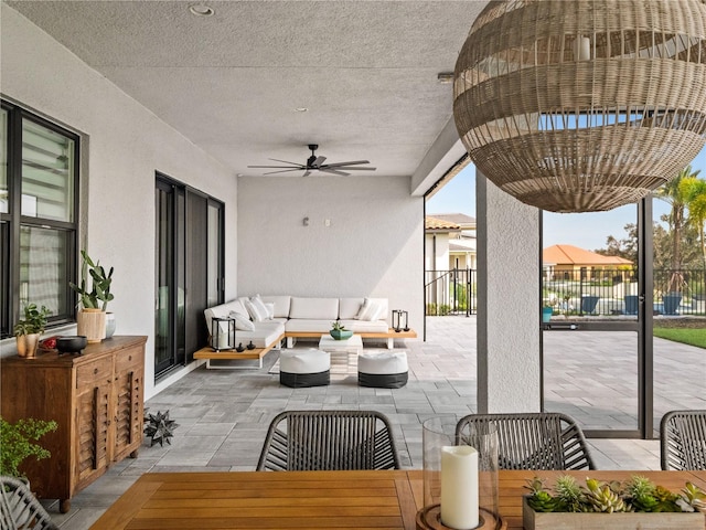 view of patio / terrace with ceiling fan and an outdoor hangout area