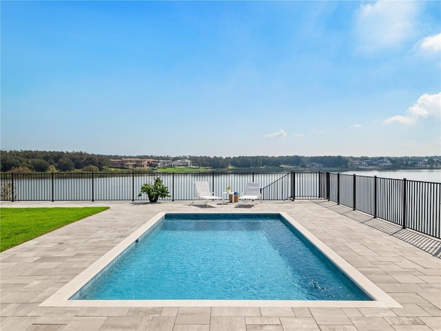 view of swimming pool featuring a patio area and a water view