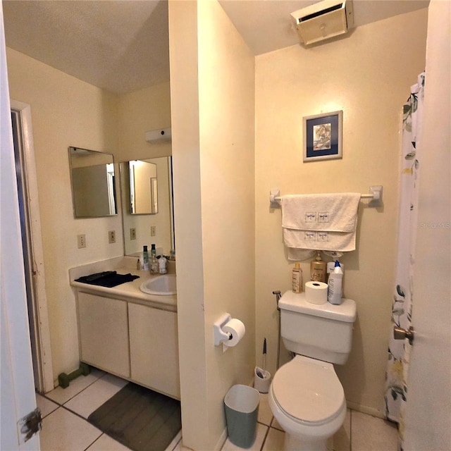 bathroom with tile patterned floors, vanity, and toilet