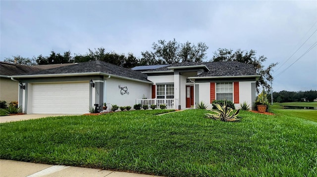 view of front of home featuring a garage and a front yard