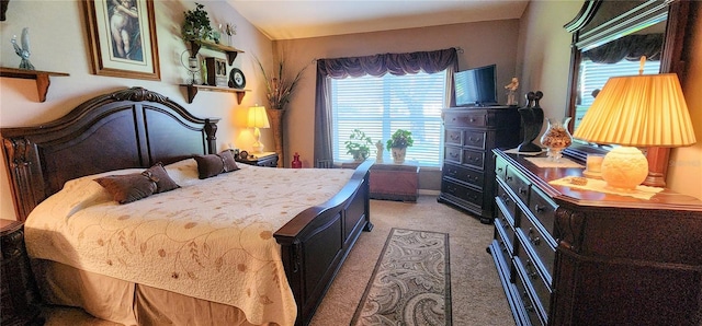 bedroom featuring vaulted ceiling and carpet flooring