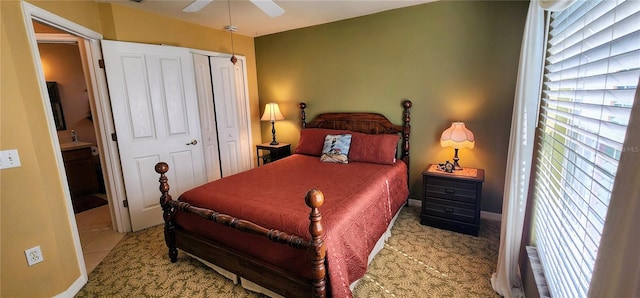 bedroom with light tile patterned floors and ceiling fan