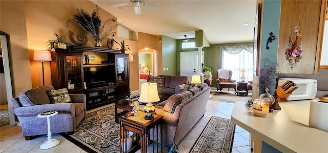 living room with ceiling fan and light tile patterned floors