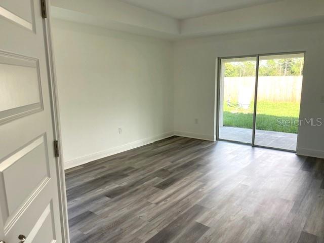 empty room featuring dark hardwood / wood-style floors