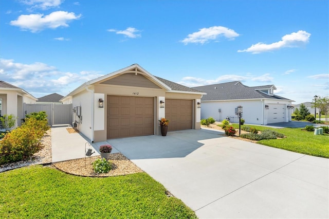 ranch-style house featuring a garage and a front yard