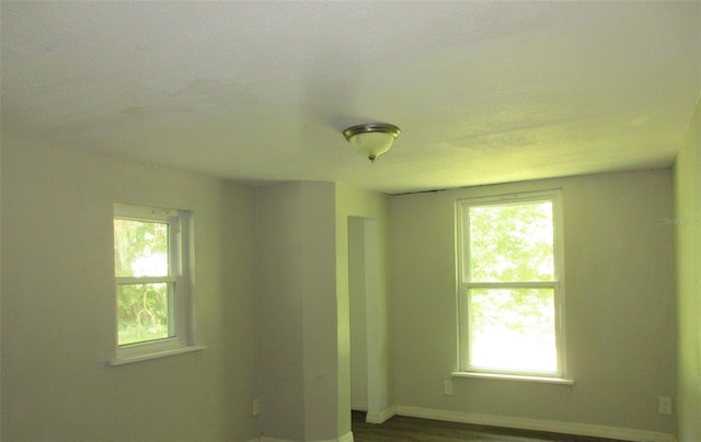 empty room featuring hardwood / wood-style flooring