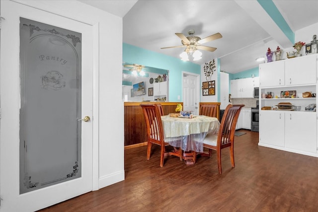 dining room featuring ceiling fan and dark hardwood / wood-style flooring