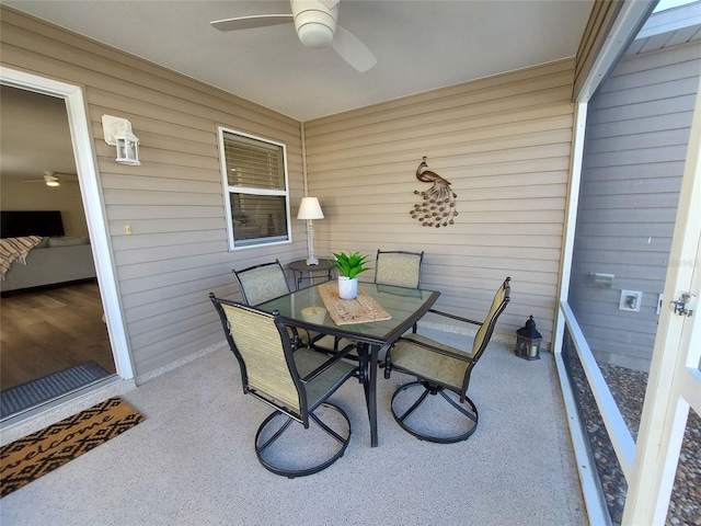 sunroom featuring ceiling fan