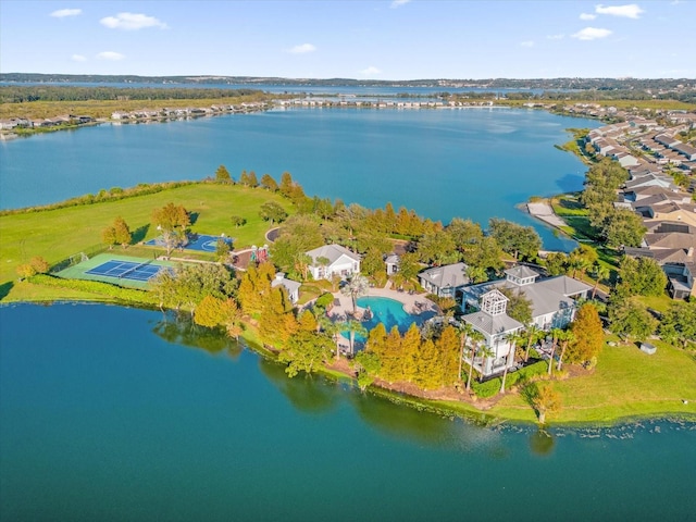 birds eye view of property with a water view