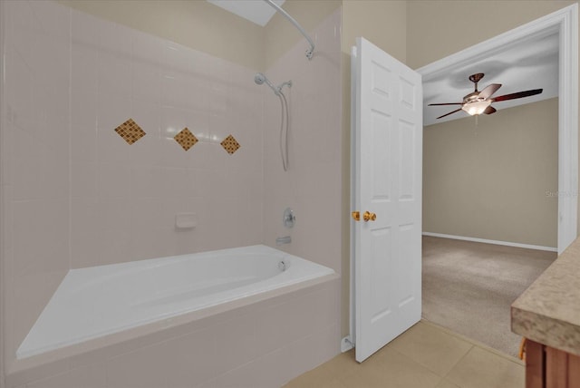 bathroom featuring vanity, tiled shower / bath, ceiling fan, and tile patterned flooring