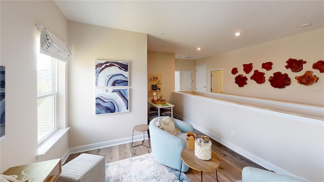 sitting room with light hardwood / wood-style floors