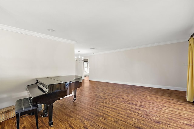 interior space with dark hardwood / wood-style flooring, ornamental molding, and an inviting chandelier