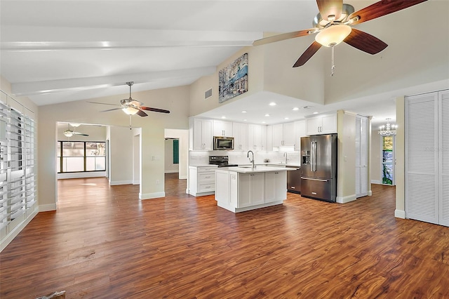 kitchen with appliances with stainless steel finishes, dark wood-type flooring, sink, a center island with sink, and white cabinets