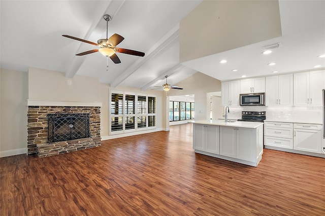 kitchen with lofted ceiling with beams, light hardwood / wood-style floors, white cabinetry, and black range with electric cooktop