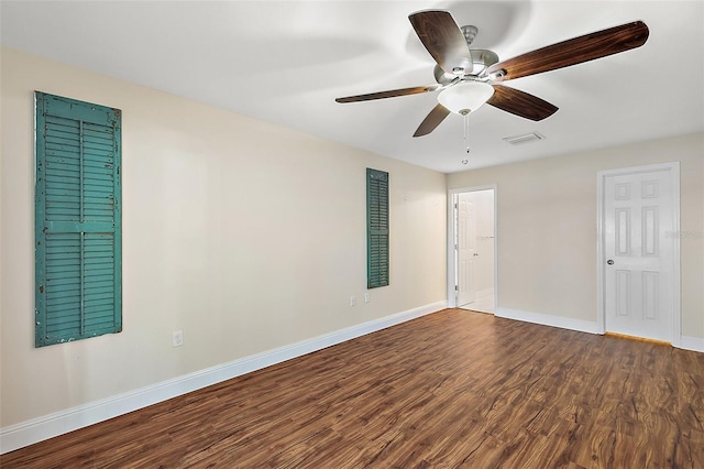 empty room with ceiling fan and hardwood / wood-style flooring