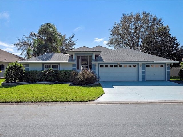 ranch-style home with a front yard and a garage