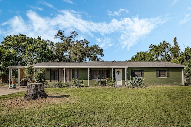 ranch-style house with a front yard and covered porch