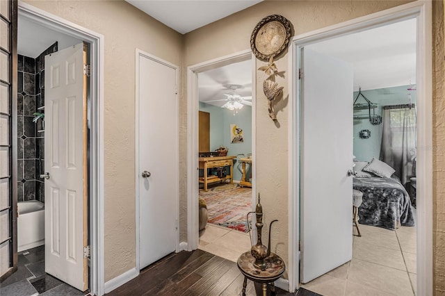 hall with hardwood / wood-style floors