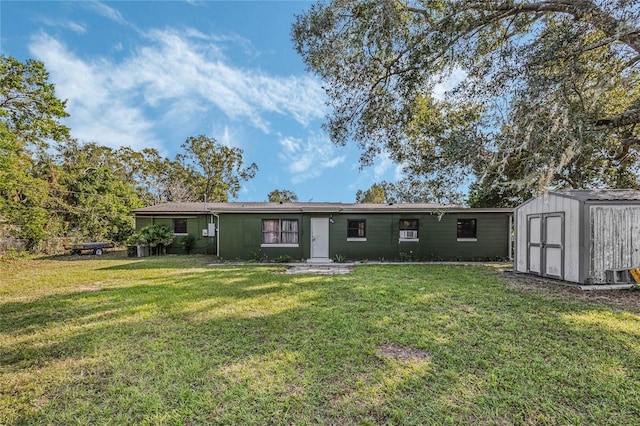 exterior space with a shed and a front yard