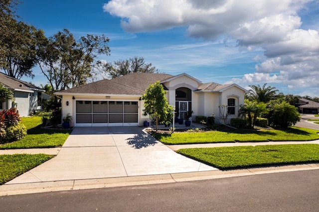 view of front facade with a front lawn and a garage