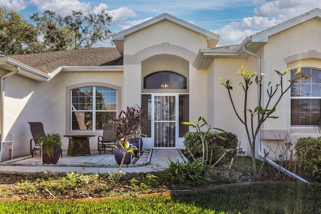 doorway to property with a patio