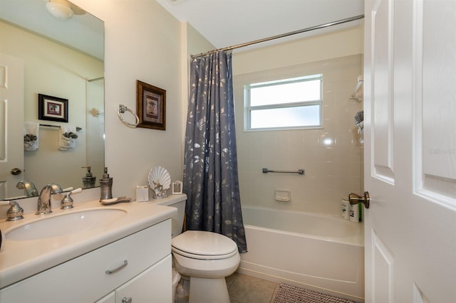 full bathroom with toilet, tile patterned floors, vanity, and shower / tub combo with curtain