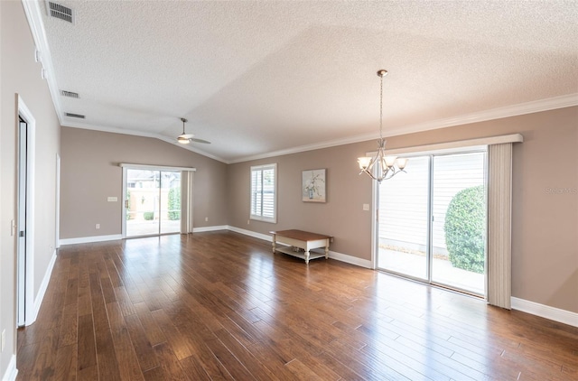 unfurnished room featuring crown molding, a textured ceiling, dark wood-type flooring, and vaulted ceiling