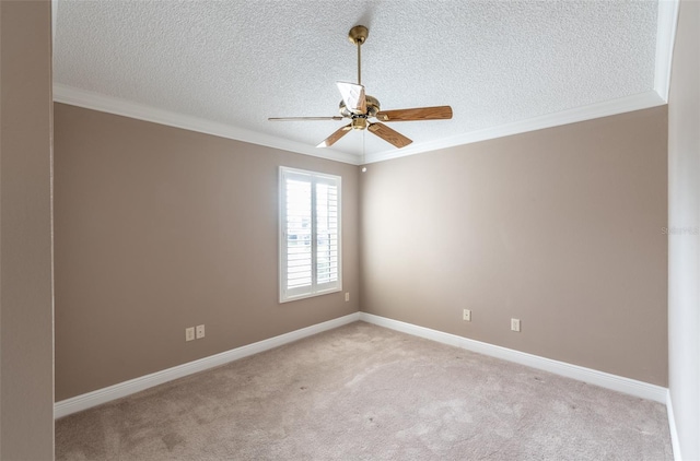 carpeted empty room with crown molding, a textured ceiling, and ceiling fan