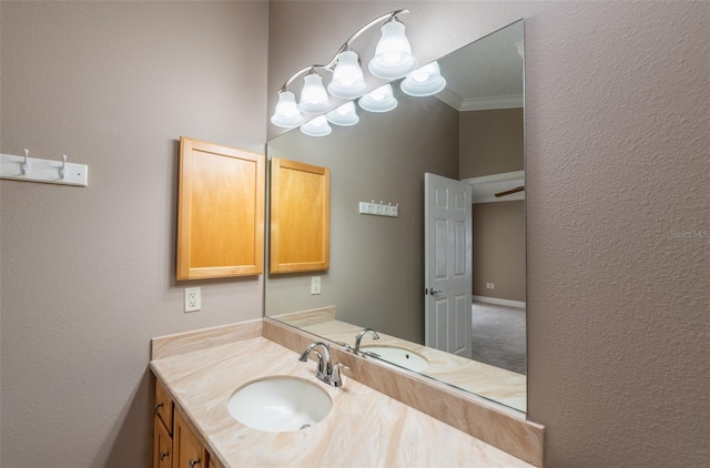 bathroom featuring vanity and ornamental molding