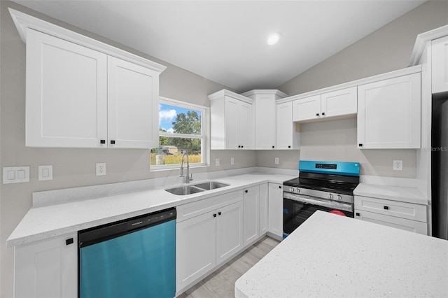 kitchen featuring white cabinetry, vaulted ceiling, light hardwood / wood-style flooring, sink, and stainless steel appliances