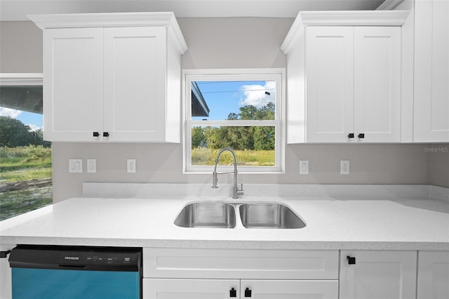 kitchen with sink, dishwasher, white cabinetry, and a healthy amount of sunlight