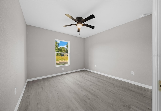 empty room featuring ceiling fan and light hardwood / wood-style flooring