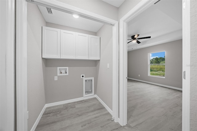 laundry room with cabinets, ceiling fan, light hardwood / wood-style flooring, hookup for a washing machine, and electric dryer hookup