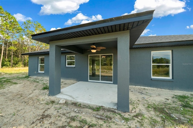 back of house featuring a patio and ceiling fan