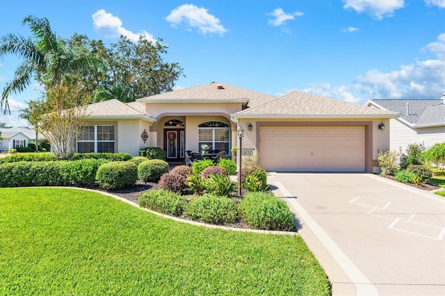 view of front facade featuring a front lawn and a garage