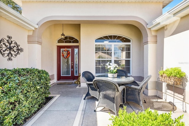 doorway to property with a patio area