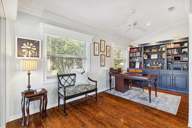 home office featuring lofted ceiling, crown molding, and dark hardwood / wood-style flooring