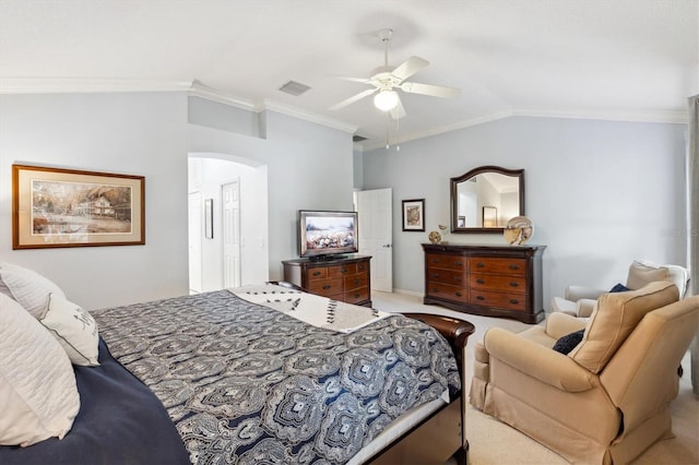 carpeted bedroom with crown molding, vaulted ceiling, and ceiling fan