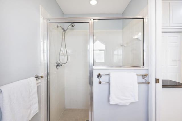 bathroom featuring an enclosed shower