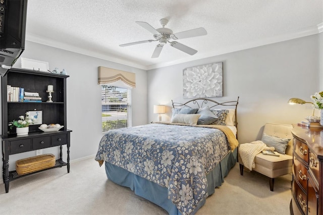 carpeted bedroom featuring crown molding, a textured ceiling, and ceiling fan