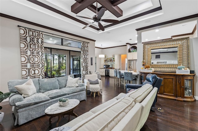 living room with ceiling fan, ornamental molding, dark hardwood / wood-style flooring, and bar