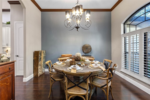 dining area with ornamental molding, an inviting chandelier, and dark hardwood / wood-style flooring