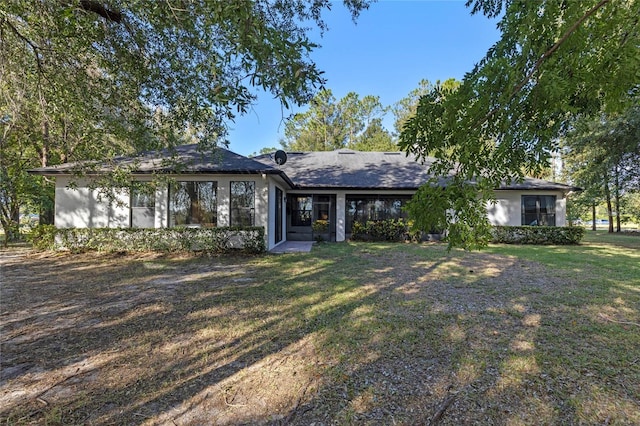 ranch-style home with a front yard