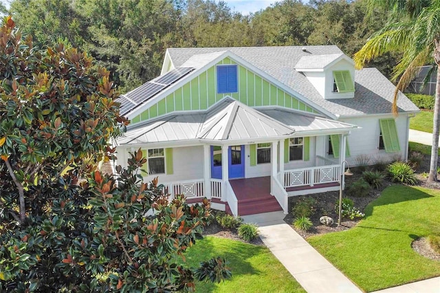 view of front of house with a front lawn and covered porch