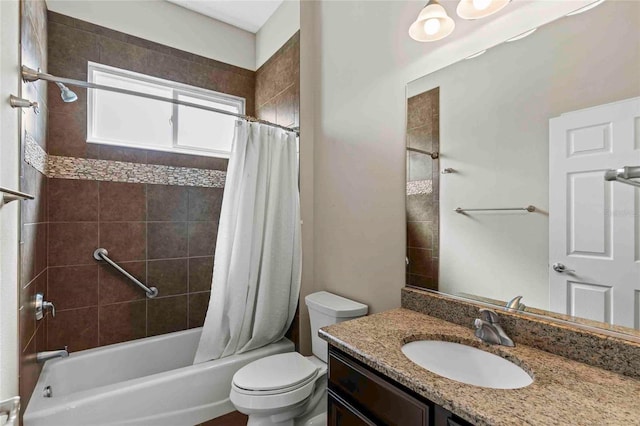 full bathroom featuring toilet, vanity, and shower / tub combo with curtain