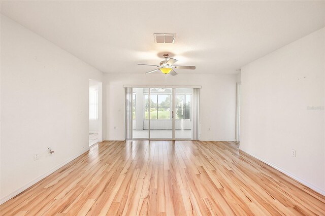 spare room featuring ceiling fan and light hardwood / wood-style flooring