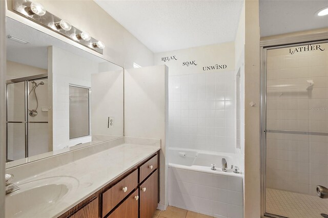 bathroom featuring vanity, independent shower and bath, and tile patterned floors